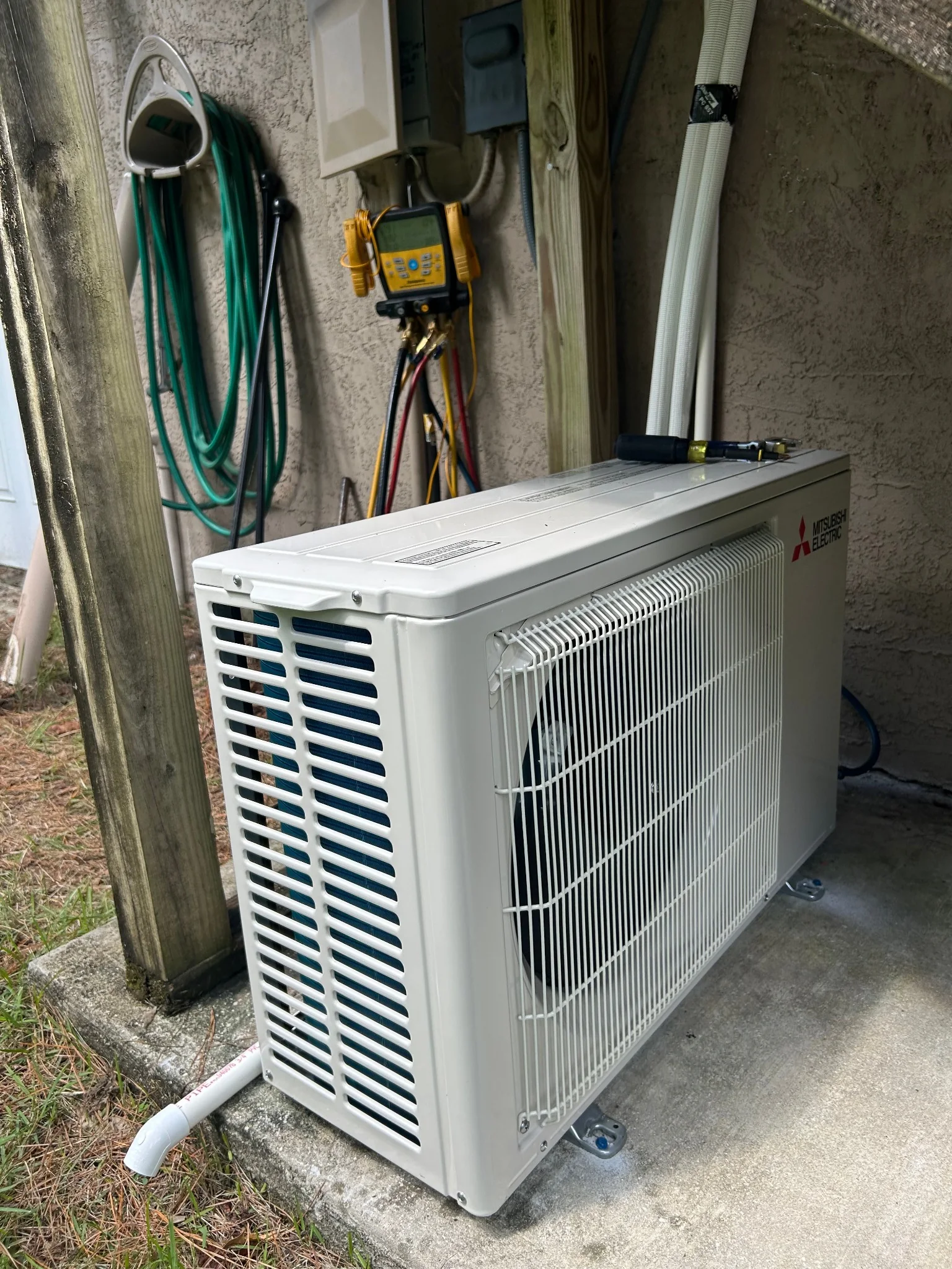 Installed Mitsubishi Electric mini-split outdoor condenser